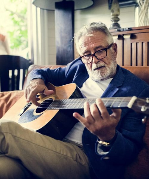 Elderly play guitar